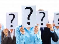 Business people with question mark on boards
